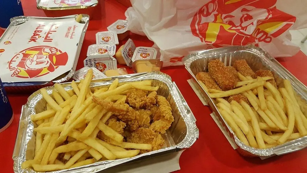 Customers ordering food at busy Albaik Makkah branch