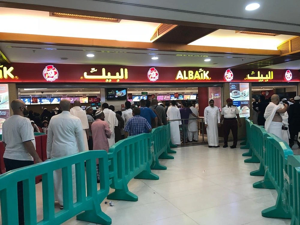 Albaik Makkah fried chicken meal with fries and garlic sauce